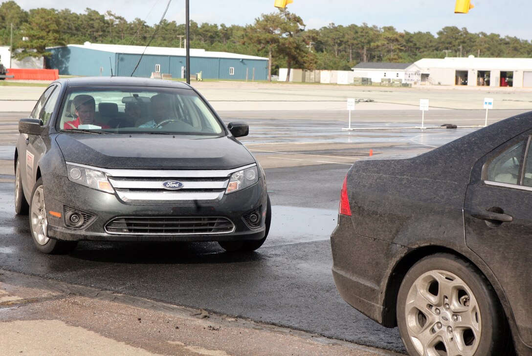 A Marine from 2nd Marine Logistics Group drives one of the vehicles during the Richard Petty Driver Experience at Marine Corps Auxiliary Landing Field Bogue, N.C., Sept. 21, 2011.  The course focused on braking, reaction times, tailgating and loss of control.  (Photo by Sgt. Rachael K. A. Moore)