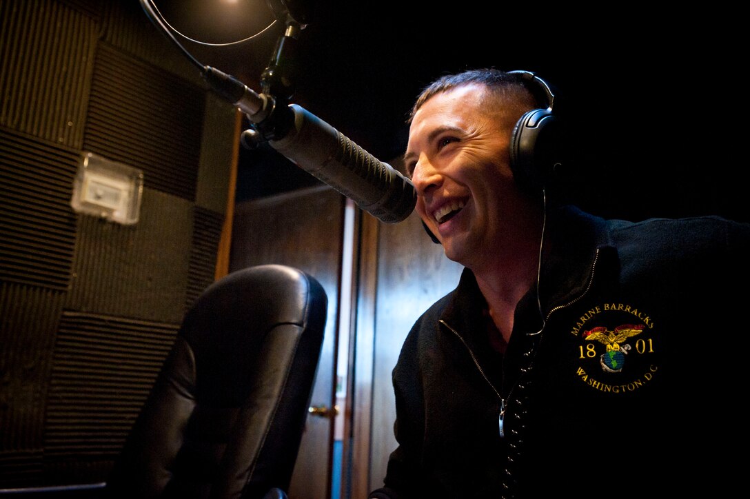 Staff Sgt. Joshua D. Miles, the U.S. Marine Drum & Bugle Corps Marketing and Public Relations Chief, shares a laugh with Russ Clark, Live and Local with Russ Clark’s radio host, during a morning show to talk about the Battle Color Detachment’s upcoming performances in the local area, at the 560 KBLU radio station, Yuma, Ariz., Feb. 27, 2012. The BCD is composed of the U.S. Marine Drum & Bugle Corps, Silent Drill Platoon and Marine Corps Color Guard, all Marine Barracks Washington-based. The BCD is scheduled to commence its National Installation Tour at the beginning of March.