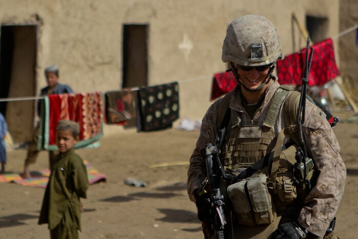 Lance Cpl. Nicholas Wurst, a team leader with 2nd Platoon, Lima Company, smiles while in a local compound Feb. 27, 2012. Wurst said he tried to keep spirits up by keeping a positive attitude and smiling, while still taking his job seriously. Wurst played songs on his guitar, that he would create, to keep his morale high while deployed.