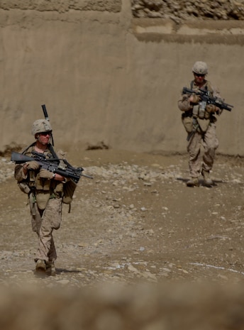 Marines with 2nd Platoon, Lima Company, 3rd Battalion, 7th Marine Regiment, patrol through Sangin, stopping to talk to the locals Feb. 27, 2012. The Marines searched for a suspected insurgent, detaining him later that day. The Marines talked to as many local people as they could, asking to speak to the head of each house.