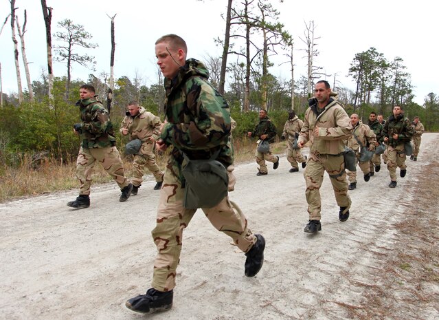 Marines and Sailors with Command Element, 24th Marine Expeditionary Unit, conduct annual chemical, biological, radiological and nuclear defense training aboard Camp Lejeune, N.C., Feb. 27, 2012. This training enabled the Marines to learn how to use the new M50 joint service general purpose gas mask.