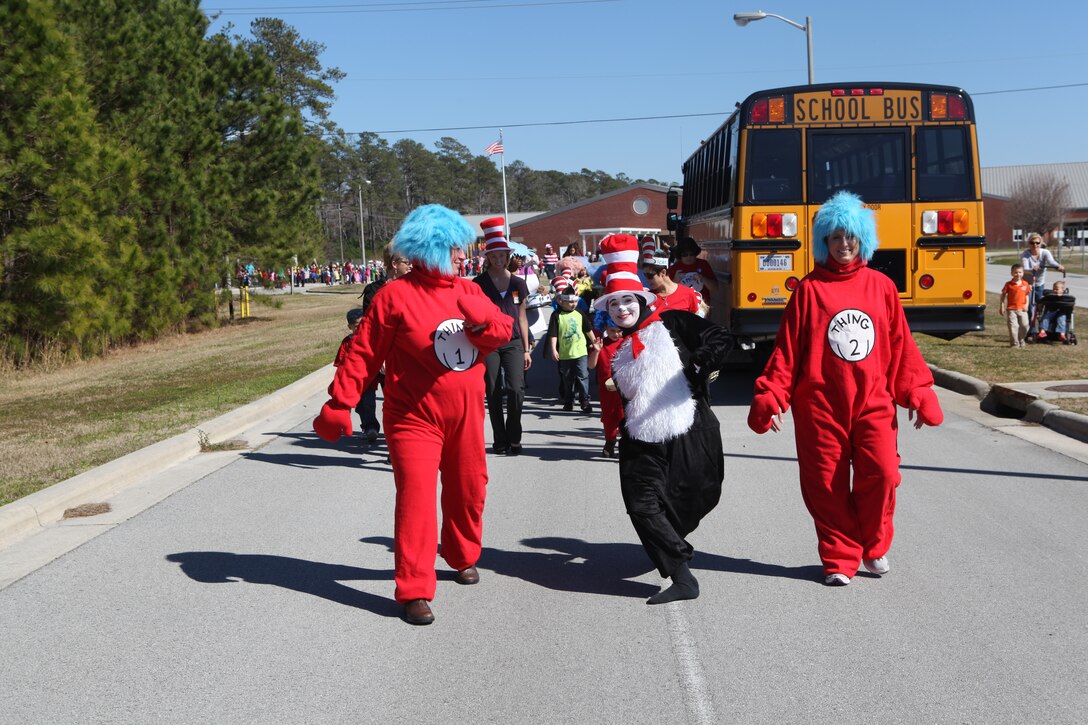 Volunteers, including a parent and teachers, lead Tarawa Terrace II::r::::n::Elementary School's annual character parade at Tarawa Terrace, a Marine Corps Base Camp Lejeune housing community, Feb. 28. The parade included characters from many popular children's books, including Dr. Seuss' works.::r::::n::