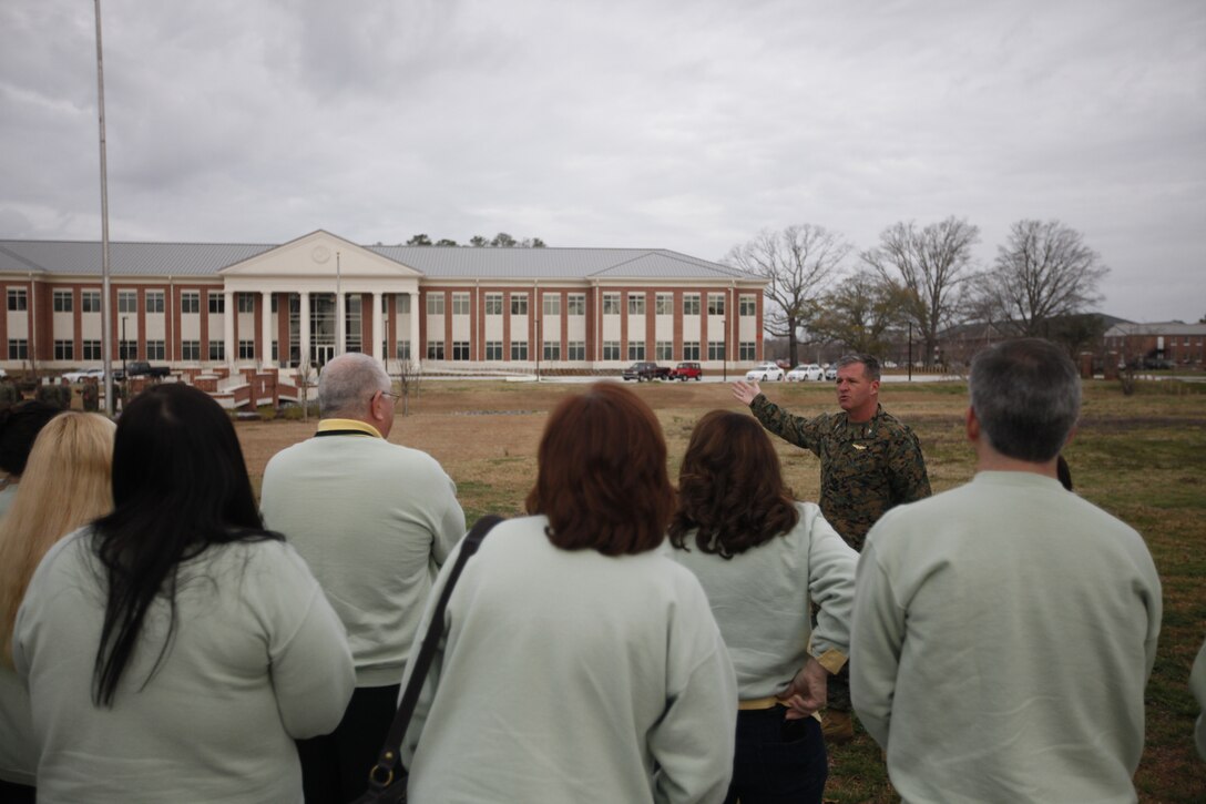 While on the parade deck of the General Christian F. Schilt building, Col. Philip J. Zimmerman, commanding officer of Marine Corps Air Station Cherry Point Cherry Point, welcomes the 31 members of the Carteret County Chamber of Commerce Executive Leadership Program aboard MCAS Cherry Point Feb. 29. “Hopefully as you experience different sites, you will gain more understanding of what it is that we do here at Cherry Point,” said Zimmerman.
