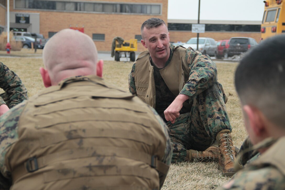 CHICAGO – Maj. A.C. Lloyd, the commanding officer of Recruiting Station Chicago takes a break after a surprise PT session at an all hands to address the SNCOICs of Chicago Feb. 29. After a cross fit work out the commanding officer challenged all of the Marines to a grappling match.
