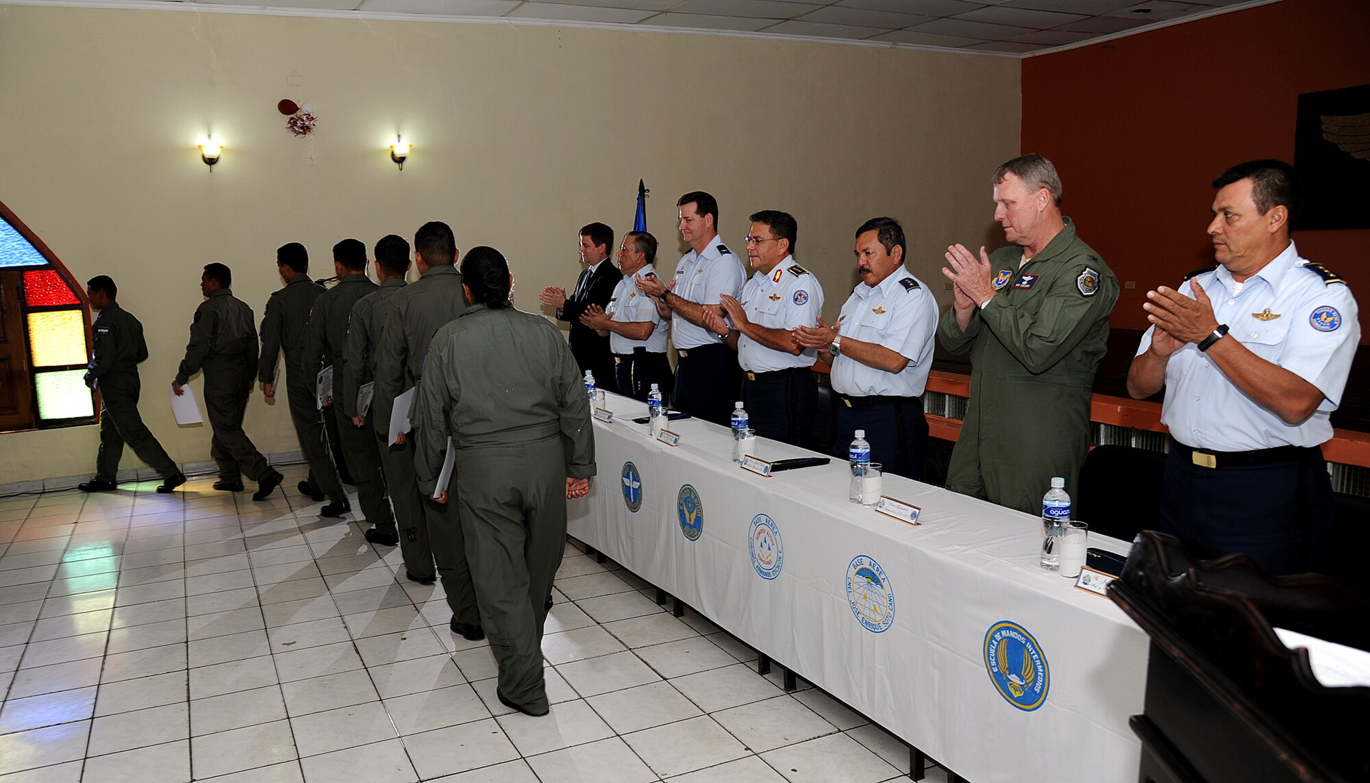 U.S. and Honduran air force senior leaders congratulate members of Honduran air force who participated in the first building partner capacity mission between the two nations during the closing ceremony, Tegucigalpa, Honduras, Feb. 23.  The 571st's mission supports 12th Air Force's (Air Forces Southern) continued engagements in the U.S. Southern Command area of responsibility of Latin America and the Caribbean.  (U.S. Air Force photo by Tech. Sgt. Lesley Waters)