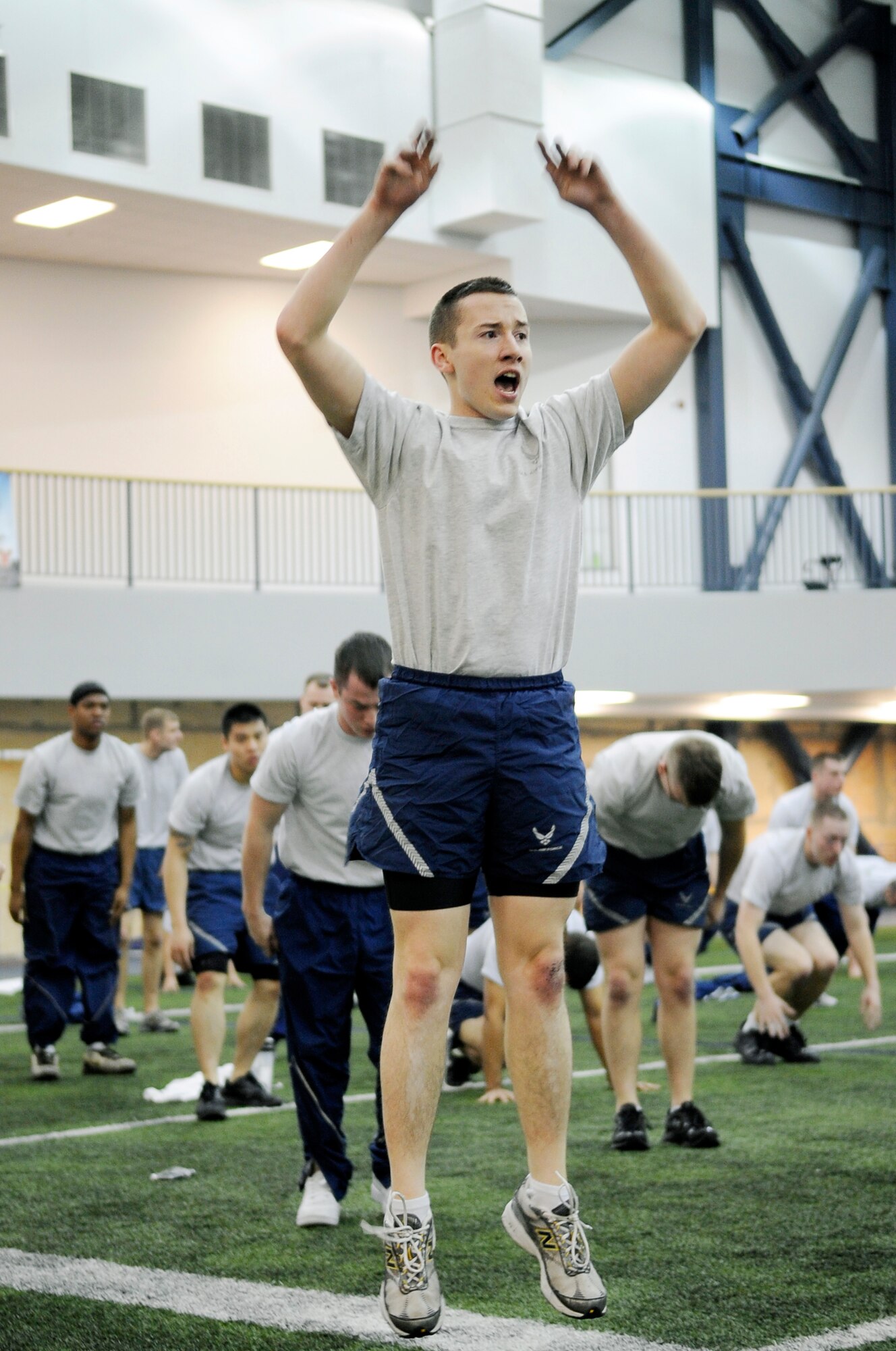 U.S. Air Force Senior Airman Scott Mathews, 354th Maintenance Squadron munitions inspector, jumps to complete a burpee during Fit Flag at Baker Field House Feb. 24, 2012, Eielson Air Force Base, Alaska. During frigid winter months, Baker Field House provides a one-eighth mile track and an 80-yard indoor field for indoor group sports such as flag football or soccer. (U.S. Air Force photo by Staff Sgt. Jim Araos)