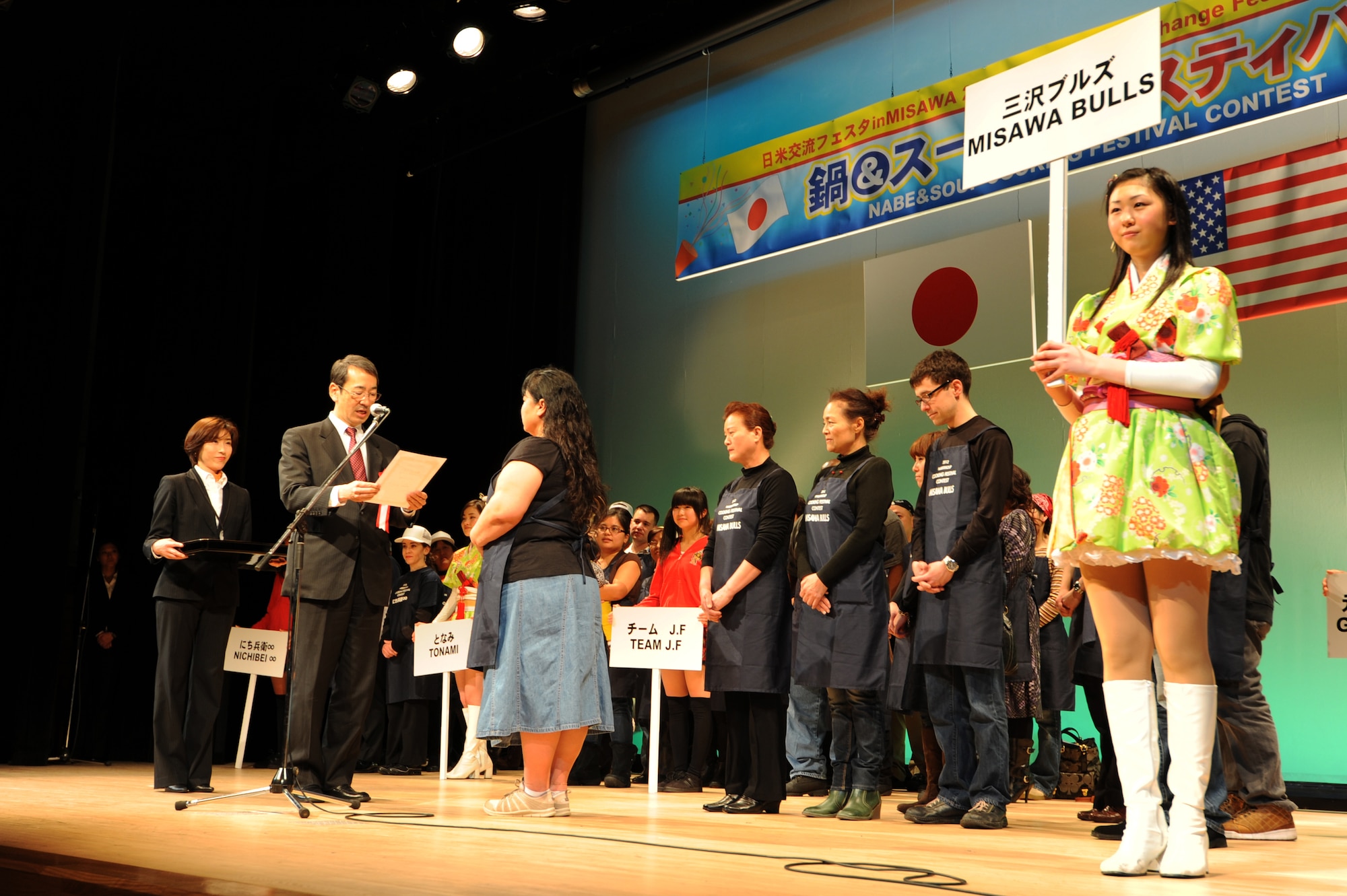 Members of the Misawa Bulls team accept the grand prize for their Meatball Suiton soup during the Japan-U.S. Exchange Festa at the Misawa International Center, Misawa City, Japan, Feb. 25, 2012. The grand prize for winning the cooking contest was ¥5,000, about $61, worth of beef from Aomori Prefecture. (U.S. Air Force photo by Airman 1st Class Kia Atkins/Released)