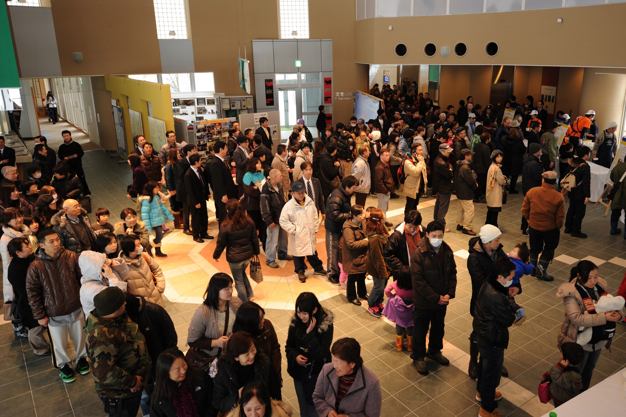 Attendees at the fourth annual Japan-U.S. Exchange Festa wait in line to try soup during the cooking festival and contest at the Misawa International Center, Misawa City, Japan, Feb. 25, 2012. Five competing teams used their talents to concoct soup to feed more than 200 people. (U.S. Air Force photo by Airman 1st Class Kia Atkins/Released)