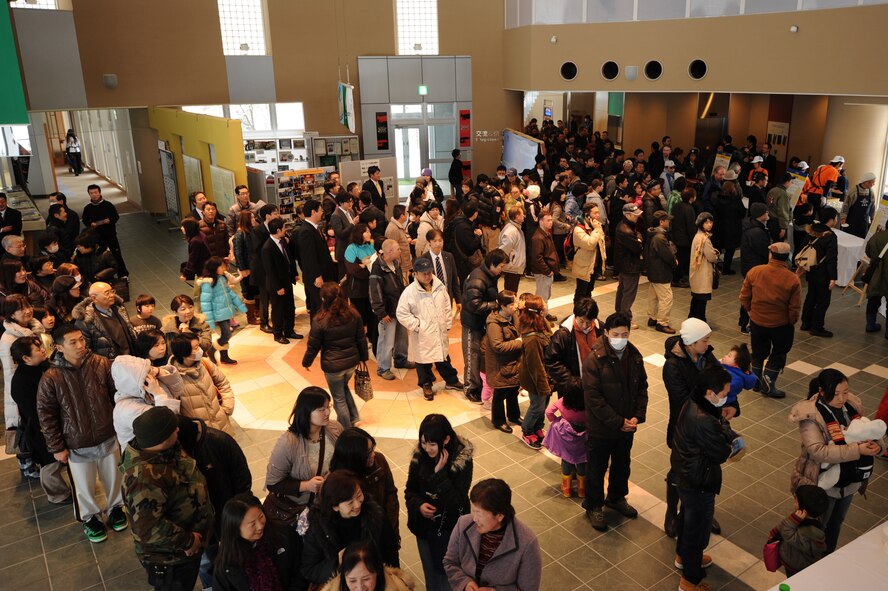 Attendees at the fourth annual Japan-U.S. Exchange Festa wait in line to try soup during the cooking festival and contest at the Misawa International Center, Misawa City, Japan, Feb. 25, 2012. Five competing teams used their talents to concoct soup to feed more than 200 people. (U.S. Air Force photo by Airman 1st Class Kia Atkins/Released)