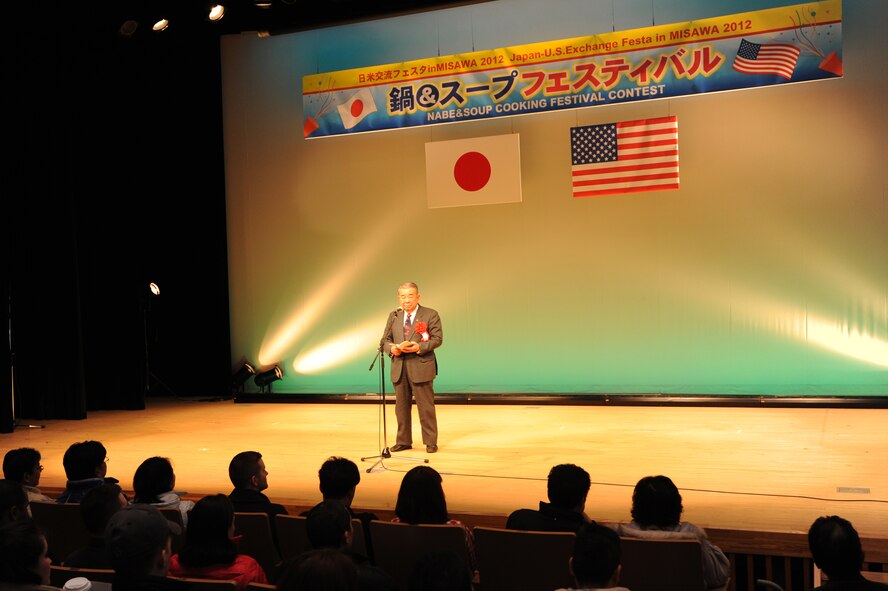 Kazumasa Taneichi, Misawa City mayor, speaks to attendees at the fourth annual Japan-U.S. Exchange Festa at the Misawa International Center, Misawa City, Japan, Feb. 25, 2012. The exchange allowed U.S. and Japanese cooks to partner and create new dishes. The theme of this year's contest focused on creating a soup dish. (U.S. Air Force photo by Airman 1st Class Kia Atkins/Released)