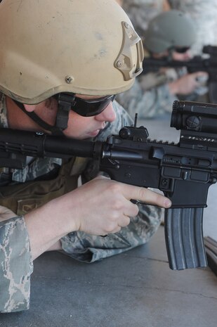 Staff Sgt. Sean McCarty, 820th REDHORSE, takes aim during a combat arms course Feb. 24 at Nellis Air Force Base, Nev. The combat arms course curriculum changed Dec. 1, 2011. (U.S. Air Force photo by Senior Airman Jack Sanders)