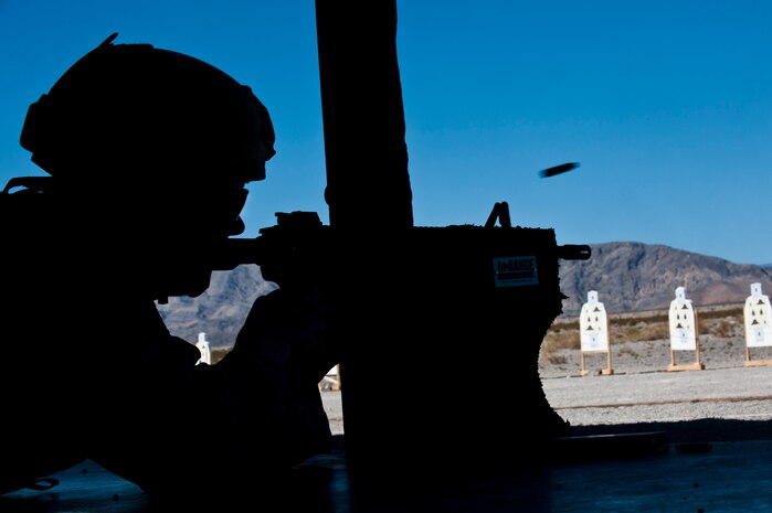 A shell casing flies as Staff Sgt. Sean McCarty, 820th RED HORSE, fires during a combat arms course Feb. 24 at Nellis Air Force Base, Nev. The combat arms course curriculum changed Dec. 1, 2011. (U.S. Air Force photo by Senior Airman Jack Sanders)