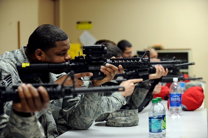 Airmen practice proper sight alignment during combat arms training Feb. 24 at Nellis Air Force Base, Nev. The combat arms course curriculum changed Dec. 1, 2011.  (U.S. Air Force photo by Senior Airman Jack Sanders)