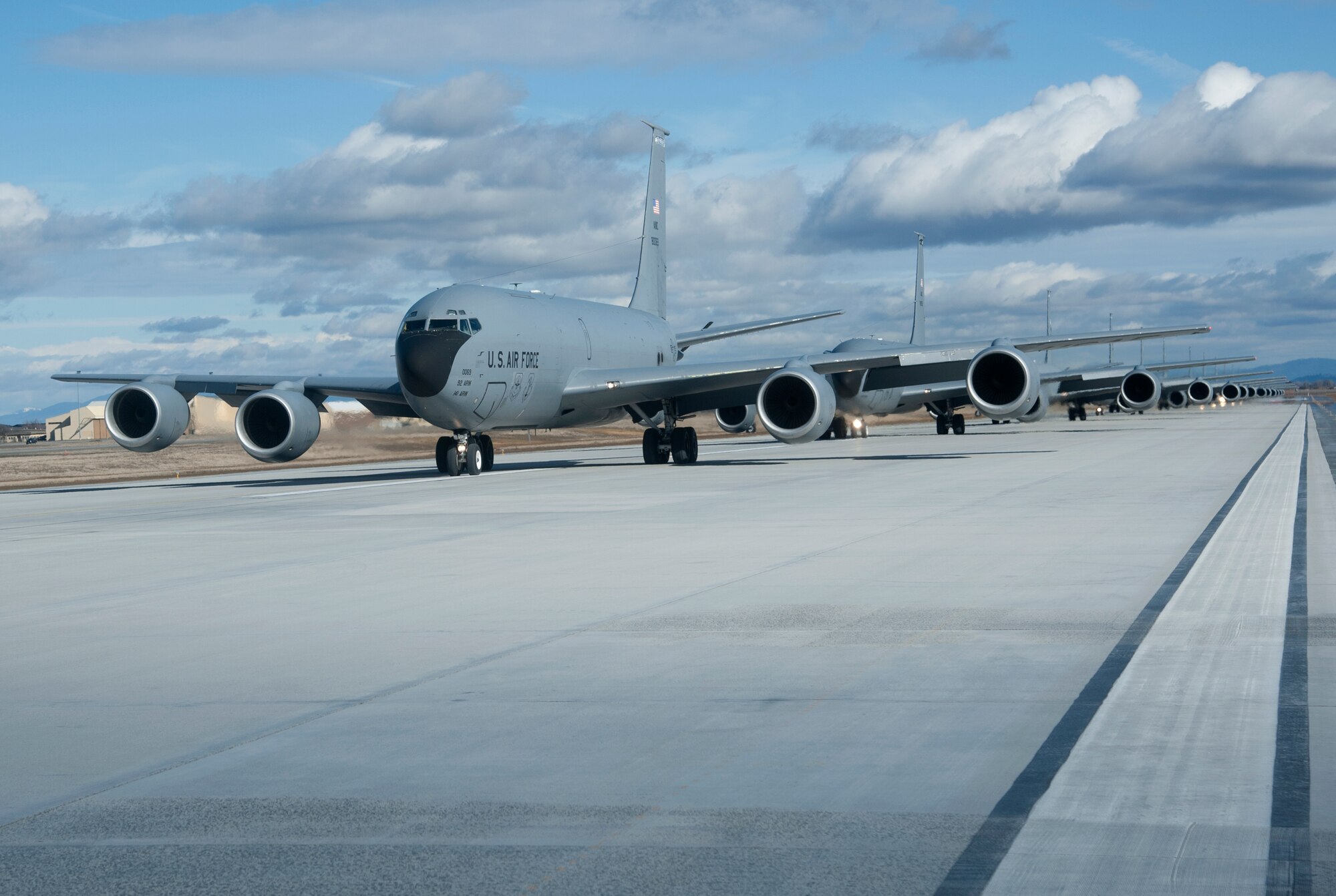KC-135 Stratotanker refueling aircraft from Fairchild Air Force Base, Wash., taxi down the runway in an "Elephant Walk" during a training mission demonstrating total force integration Feb. 23, 2012. Personnel from the 92nd and 141st Air Refueling Wings executed the mission and launched several aircraft. "Elephant Walk" is a historic, uniquely-Air Force term that describes the nose-to-tail, single-file taxi movements of the aircraft synonymous with the nose-to-tail trail of lumbering elephants. (U.S. Air Force photo by Staff Sgt. Michael Means)