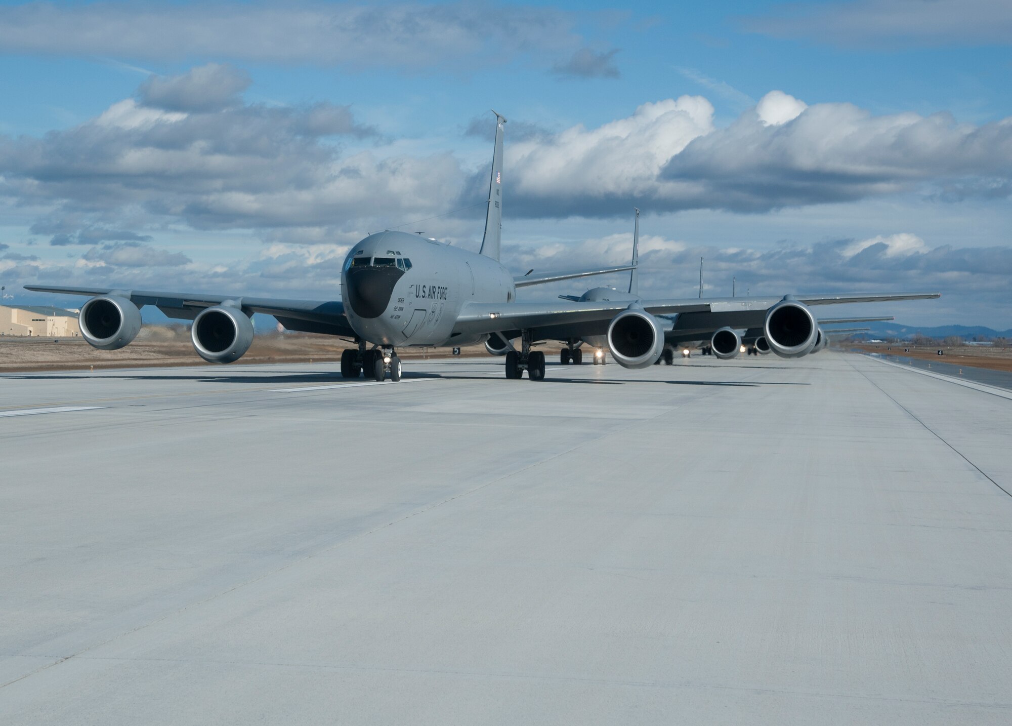 KC-135 Stratotanker refueling aircraft from Fairchild Air Force Base, Wash., taxi down the runway in an "Elephant Walk" during a training mission demonstrating total force integration Feb. 23, 2012. Personnel from the 92nd and 141st Air Refueling Wings executed the mission and launched several aircraft. "Elephant Walk" is a historic, uniquely-Air Force term that describes the nose-to-tail, single-file taxi movements of the aircraft synonymous with the nose-to-tail trail of lumbering elephants. (U.S. Air Force photo by Staff Sgt. Michael Means)