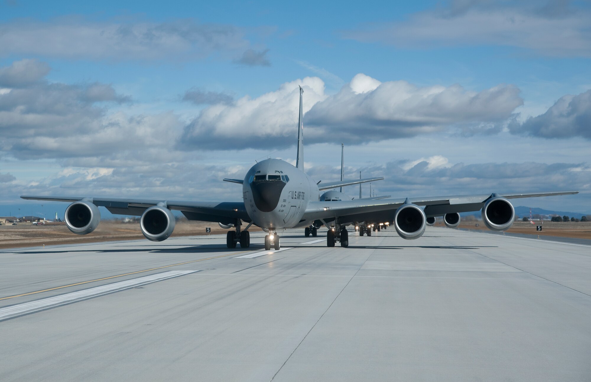KC-135 Stratotanker refueling aircraft from Fairchild Air Force Base, Wash., taxi down the runway in an "Elephant Walk" during a training mission demonstrating total force integration Feb. 23, 2012. Personnel from the 92nd and 141st Air Refueling Wings executed the mission and launched several aircraft. "Elephant Walk" is a historic, uniquely-Air Force term that describes the nose-to-tail, single-file taxi movements of the aircraft synonymous with the nose-to-tail trail of lumbering elephants. (U.S. Air Force photo by Staff Sgt. Michael Means)