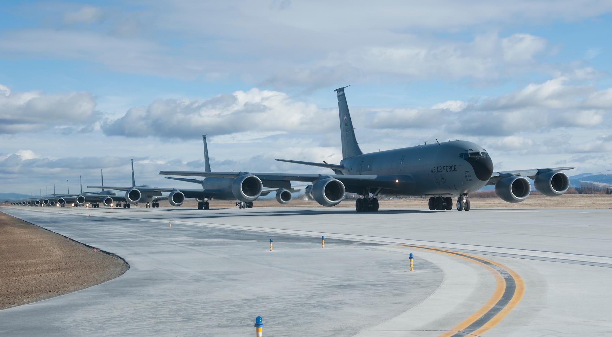 KC-135 Stratotanker refueling aircraft from Fairchild Air Force Base, Wash., taxi down the runway in an "Elephant Walk" during a training mission demonstrating total force integration Feb. 23, 2012. Personnel from the 92nd and 141st Air Refueling Wings executed the mission and launched several aircraft. "Elephant Walk" is a historic, uniquely-Air Force term that describes the nose-to-tail, single-file taxi movements of the aircraft synonymous with the nose-to-tail trail of lumbering elephants. (U.S. Air Force photo by Staff Sgt. Michael Means)