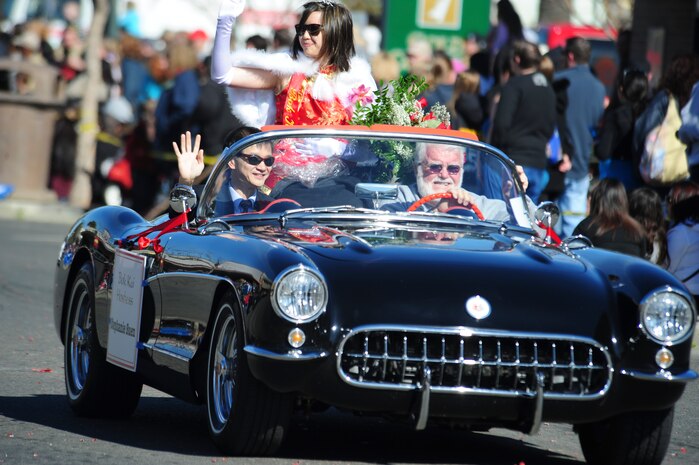 Stephanie Suen, the Bok Kai hostess, waves to the crowd during the 132nd Annual Bok Kai parade in Marysville, Calif., Feb. 25, 2012. The Bok Kai festival and parade are held in tribute to the many Chinese who worked in the gold mines during the 1800s, and is centered around the Bok Kai Temple in downtown Marysville. (U.S. Air Force photo by Staff Sgt. Sarah Brown/Released)