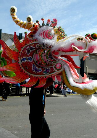 A member of Beale Air Force Base carries the head of the Water Dragon featured at the 2012 Bok Kai festival in Marysville, Calif., Feb 25, 2012. The Bok Kai parade, held every year, features a variety of floats and cultural performances. (U.S. Air Force photo by Senior Airman Sandra Healy)