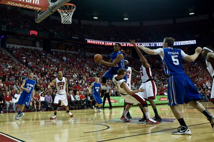Kyke Green, U.S. Air Force Academy "Falcons" junior guard, drawls the foul on the drive against the University of Nevada Las Vegas, at the Thomas and Mack Center, Feb. 25, 2012, in Las Vegas, Nev. The Air Force Falcons came up short against UNLV 68-58, making their record 13-13 overall and 3-9 in the Mountain West Conference. (U.S. Air Force photo by Airman 1st Class Daniel Hughes)