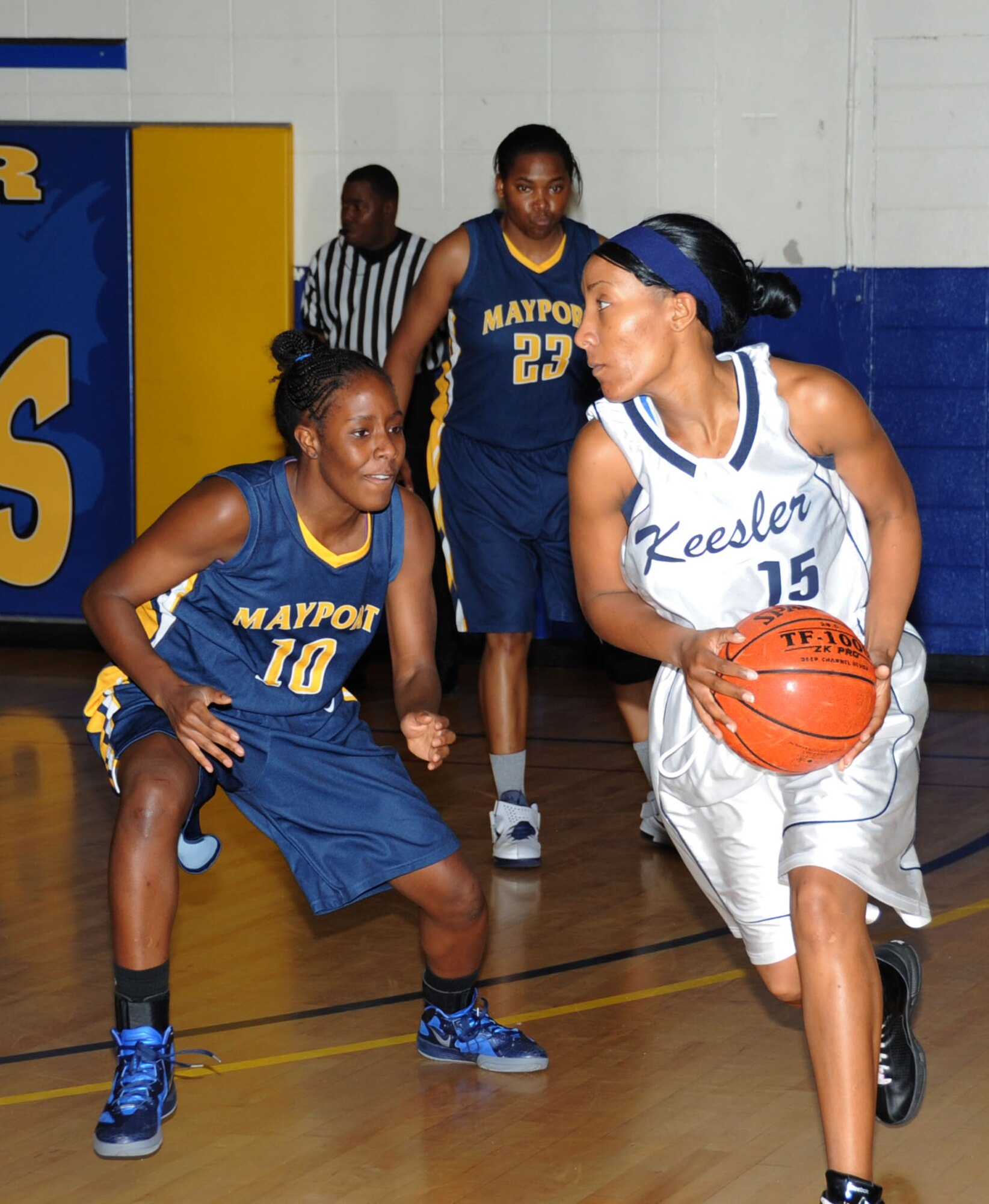 Erica Sims, team Mayport, plays defense against Keesler’s Tomeika Washington, while Mayport’s Nicole Bolden stands fast to protect the goal during a Southeastern Military Athletic Conference Women’s basketball tournament game Feb. 25, 2012, in the Blake Fitness Center at Keesler Air Force Base, Miss. Naval Station Mayport defeated Keesler 56-49. Keesler finished 3rd place in the tournament.  (U.S. Air Force photo by Kemberly Groue)