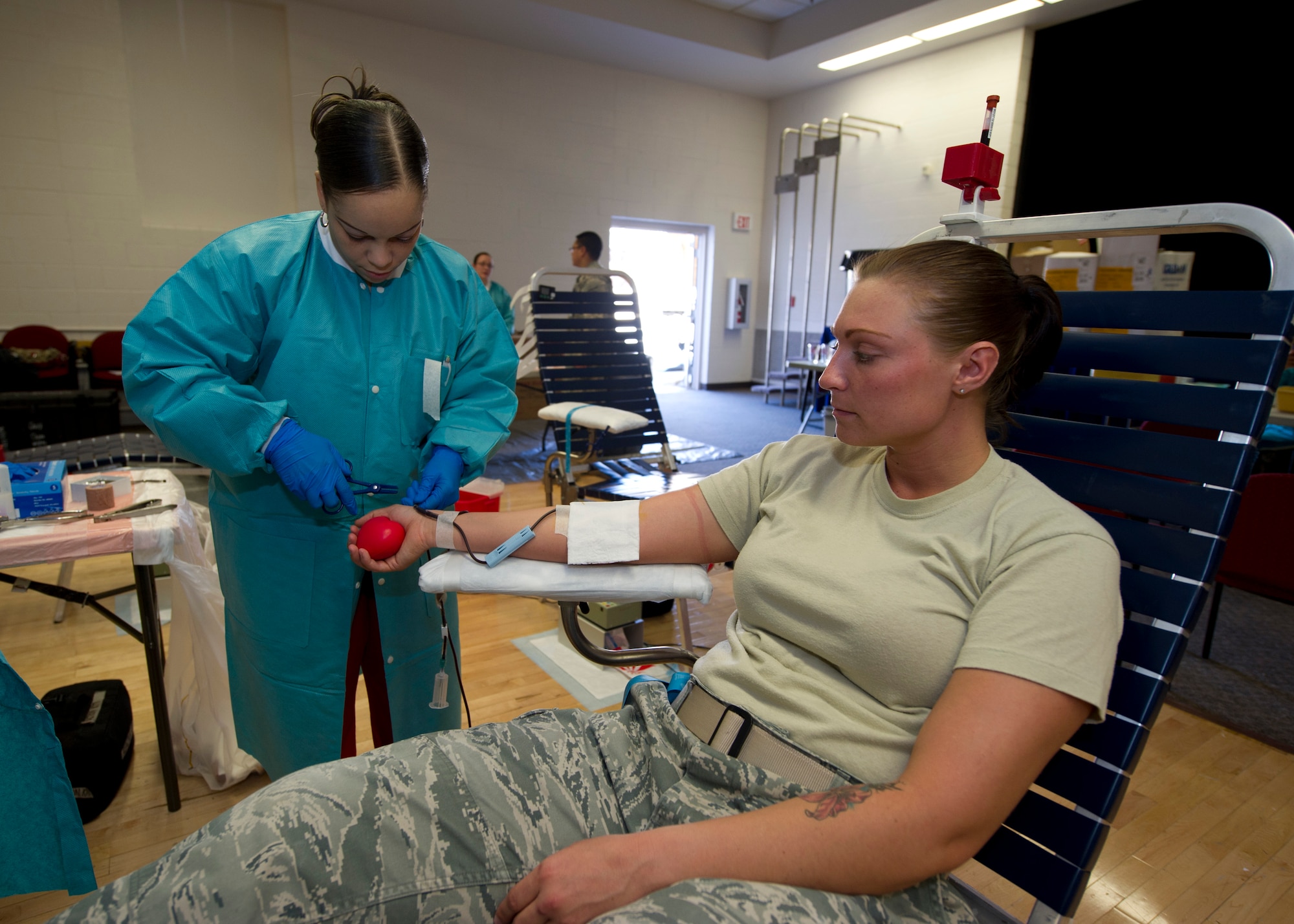 HOLLOMAN AIR FORCE BASE, N.M. -- Bridget Neal, a phlebotomist from the Blood Donor Center at William Beaumont Army Medical Center in El Paso, Texas, draws blood from Staff Sgt. Heather Walker, 49th Materiel Maintenance Support Squadron, during an Armed Services Blood Drive Feb. 24, at the Community Activity Center. Members from the Blood Donor Center at WBAMC travel to military installations throughout the southwest region of the U.S. to collect blood donations from military members, their families and civilians with access to the different installations. (U.S. Air Force photo by Tech. Sgt. Joe Laws/Released)