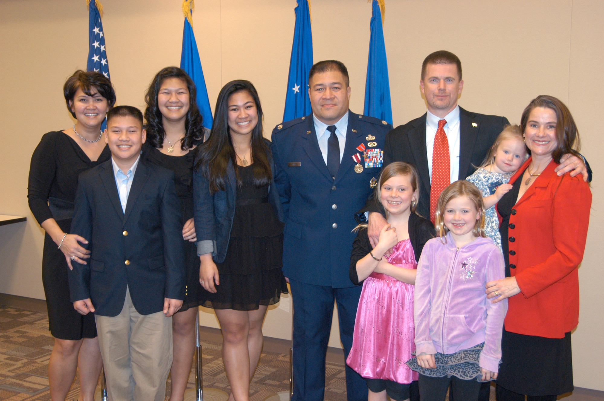 Lt. Col. (SA) Vasaga Tilo, left, and OSI Special Agent Andrew Schad both received Bronze Star Medals Feb. 23 at OSI Heaquarters in Quantico, Va. They are pictured here with their families at the ceremony. (U.S. Air Force picture by Mr. James C. Dillard.) 