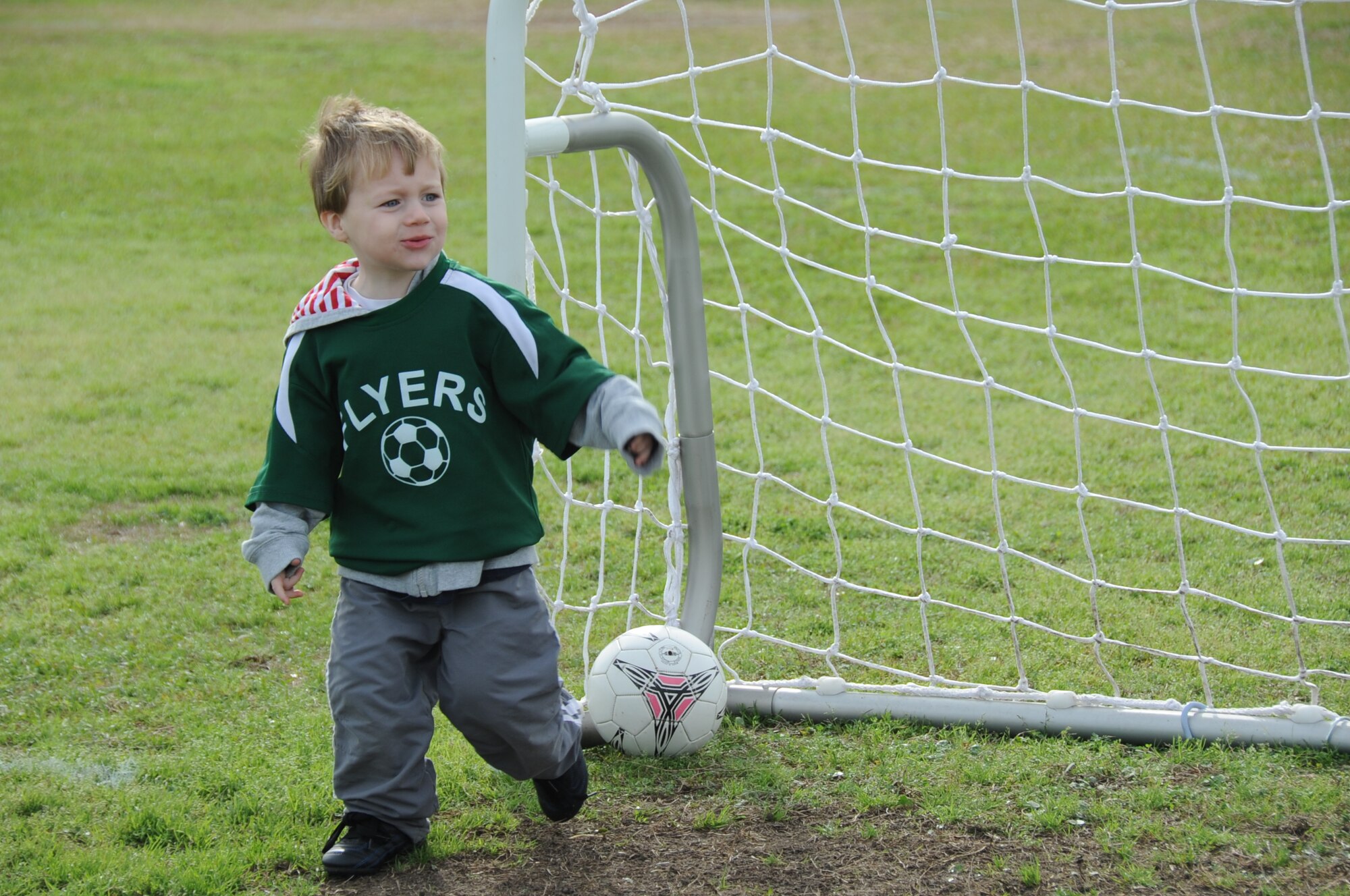 Three-year-old Jude Barber, son of Lindsay and Staff Sgt. Isaac Barber, 334th Training Squadron, scores a goal during a three-to-four year old youth soccer game against the Kings, Feb. 25, 2012, on the fields behind the Youth Center, Keesler Air Force Base, Miss.  (U.S. Air Force photo by Kemberly Groue)