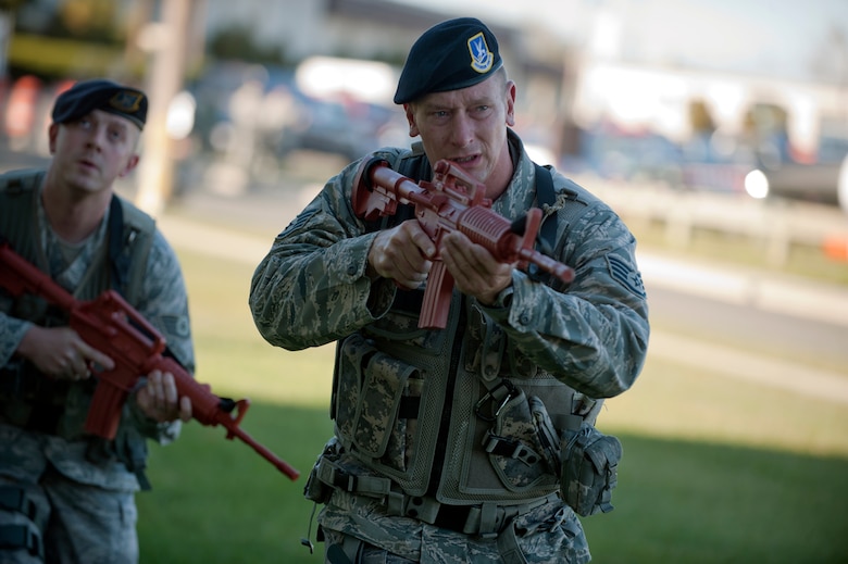 WESTHAMPTON BEACH, NY - Members of the 106th Rescue Wing's Security Forces Squadron take part in "active shooter" training on November 6th, 2011 at F.S. Gabreski (ANG) in Long Island. In this scenerio, an element of Security Forces airmen move in a tactical formation towards Building 345, where there have been reports of shots fired. 

