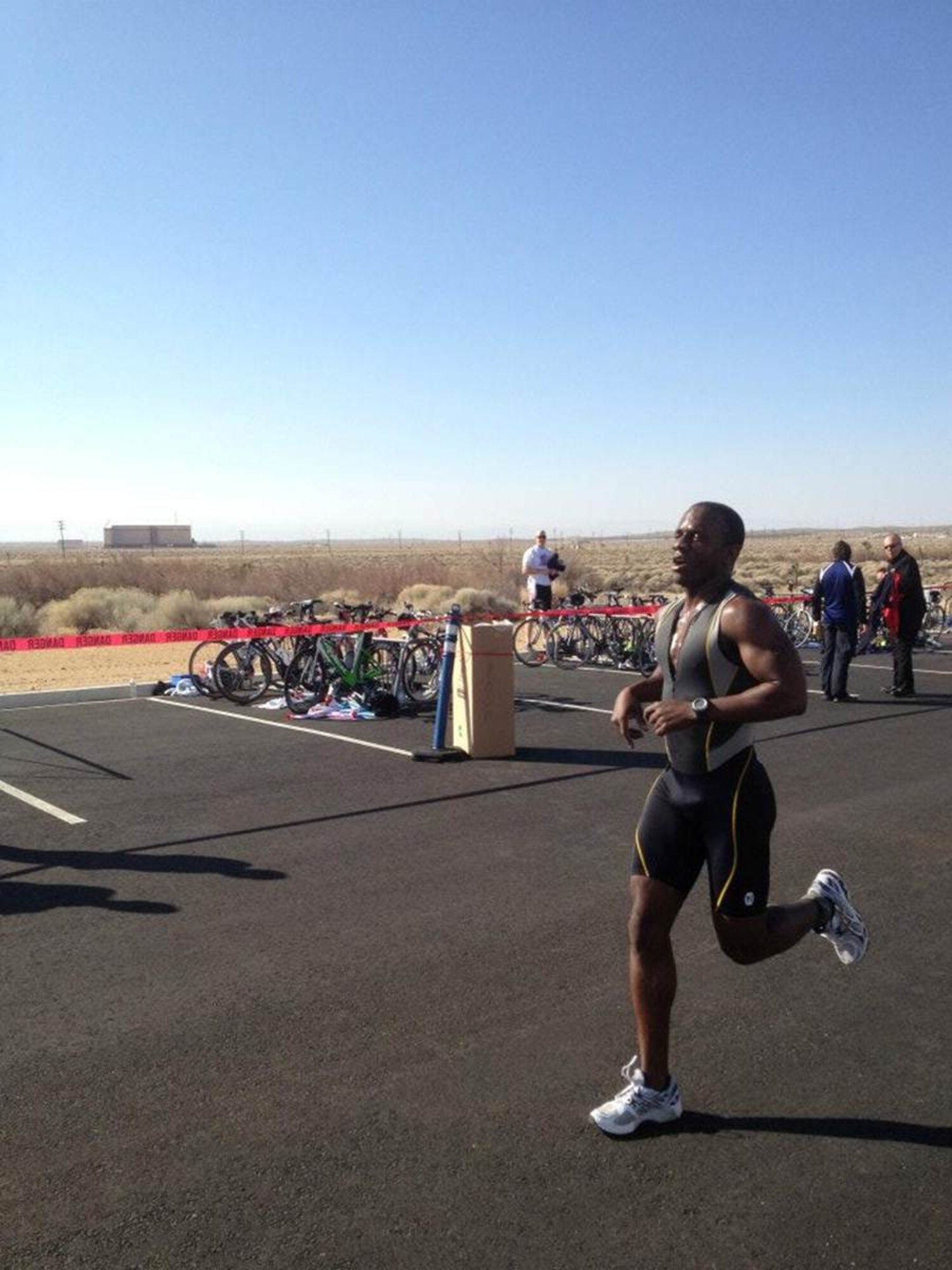 Capt. Will Taylor, 31st Training and Evaluation Squadron, finishes the “High Desert Sprint Triathlon” Feb. 25. Thirty-eight triathletes competed in the first triathlon held at Edwards in 10 years. (Courtesy photo by Lt. Col. Brian O’Neill)