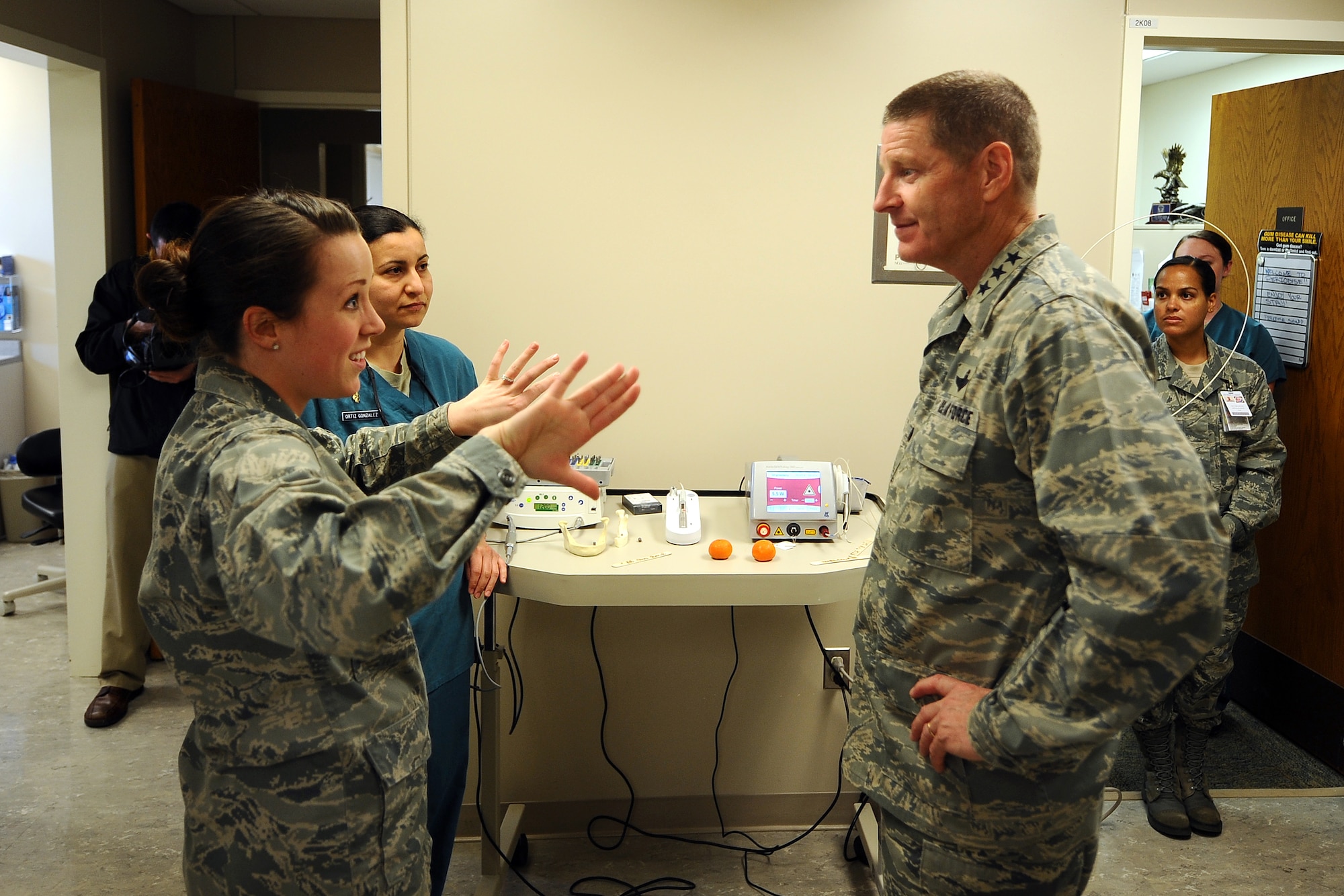 U.S. Air Force Capt. Christina Alcorn, a general dentist with the 55th Medical Group, showcases a new surgical dental laser to Lt. Gen. Robin Rand, 12th Air Force commander, at the Ehrling Bergquist Clinic at Offutt Air Force Base, Neb., Feb. 21. 55th Medical Group professionals got to demonstrate a variety of missions that take place at the clinic.  (U.S. Air Force photo by Josh Plueger/Released).