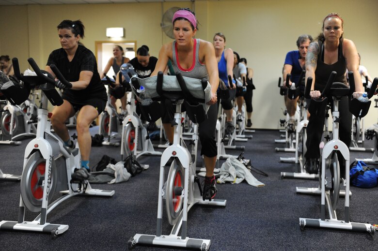 SPANGDAHLEM AIR BASE, Germany – Base members participate in a spin-a-thon at the Skelton Memorial Fitness Center here Feb. 25. The spin-a-thon was a period of high-intensity indoor cycling that allowed members to challenge their cardio fitness with an option of signing up for one to three hours of spinning. Participants were guided by instructors through different workout phases with a variety of up-beat music. Spin class is one way to get a workout that burns calories and keeps bodies in shape offered at the fitness center. (U.S. Air Force photo by Senior Airman Christopher Toon/Released)