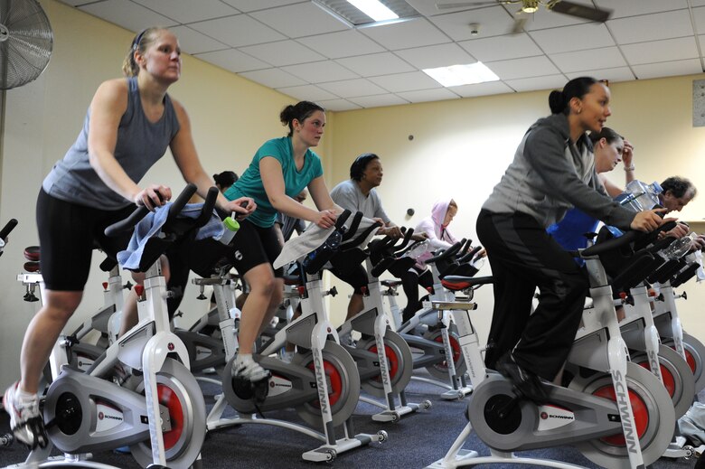 SPANGDAHLEM AIR BASE, Germany – Base members participate in a spin-a-thon at the Skelton Memorial Fitness Center here Feb. 25. The spin-a-thon was a period of high-intensity indoor cycling that allowed members to challenge their cardio fitness with an option of signing up for one to three hours of spinning. Participants were guided by instructors through different workout phases with a variety of up-beat music. Spin class is one way to get a workout that burns calories and keeps bodies in shape offered at the fitness center. (U.S. Air Force photo by Senior Airman Christopher Toon/Released)