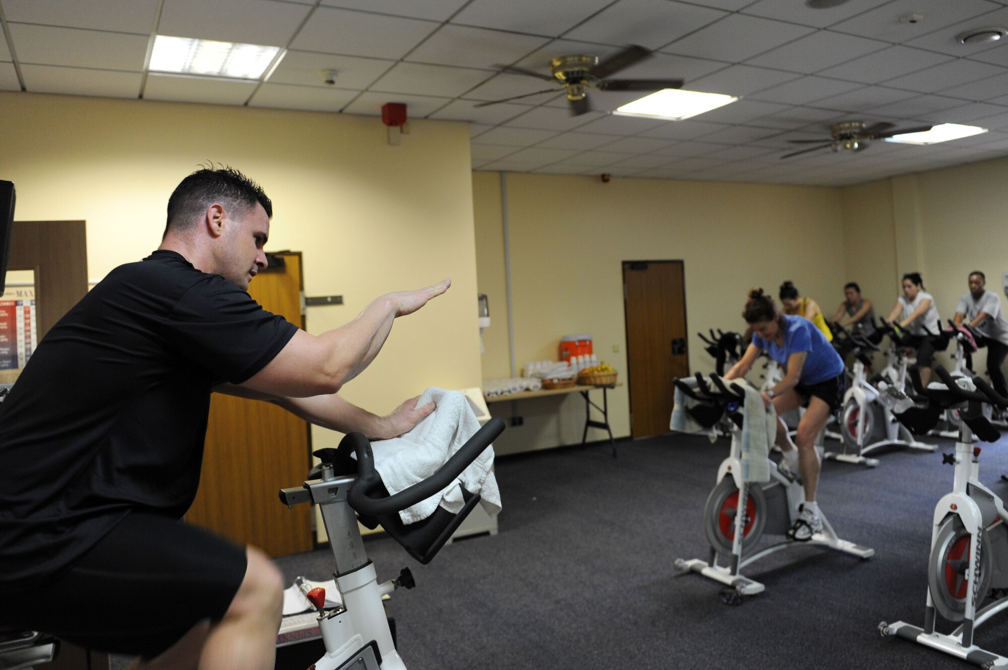 SPANGDAHLEM AIR BASE, Germany – Master Sgt. Mauli Martine, 52nd Logistics Readiness Squadron and spin instructor, leads the first hour of a spin-a-thon at the Skelton Memorial Fitness Center here Feb. 25. The spin-a-thon was a period of high-intensity indoor cycling that allowed members to challenge their cardio fitness with an option of signing up for one to three hours of spinning. Participants were guided by instructors through different workout phases with a variety of up-beat music. Spin class is one way to get a workout that burns calories and keeps bodies in shape offered at the fitness center. (U.S. Air Force photo by Senior Airman Christopher Toon/Released)