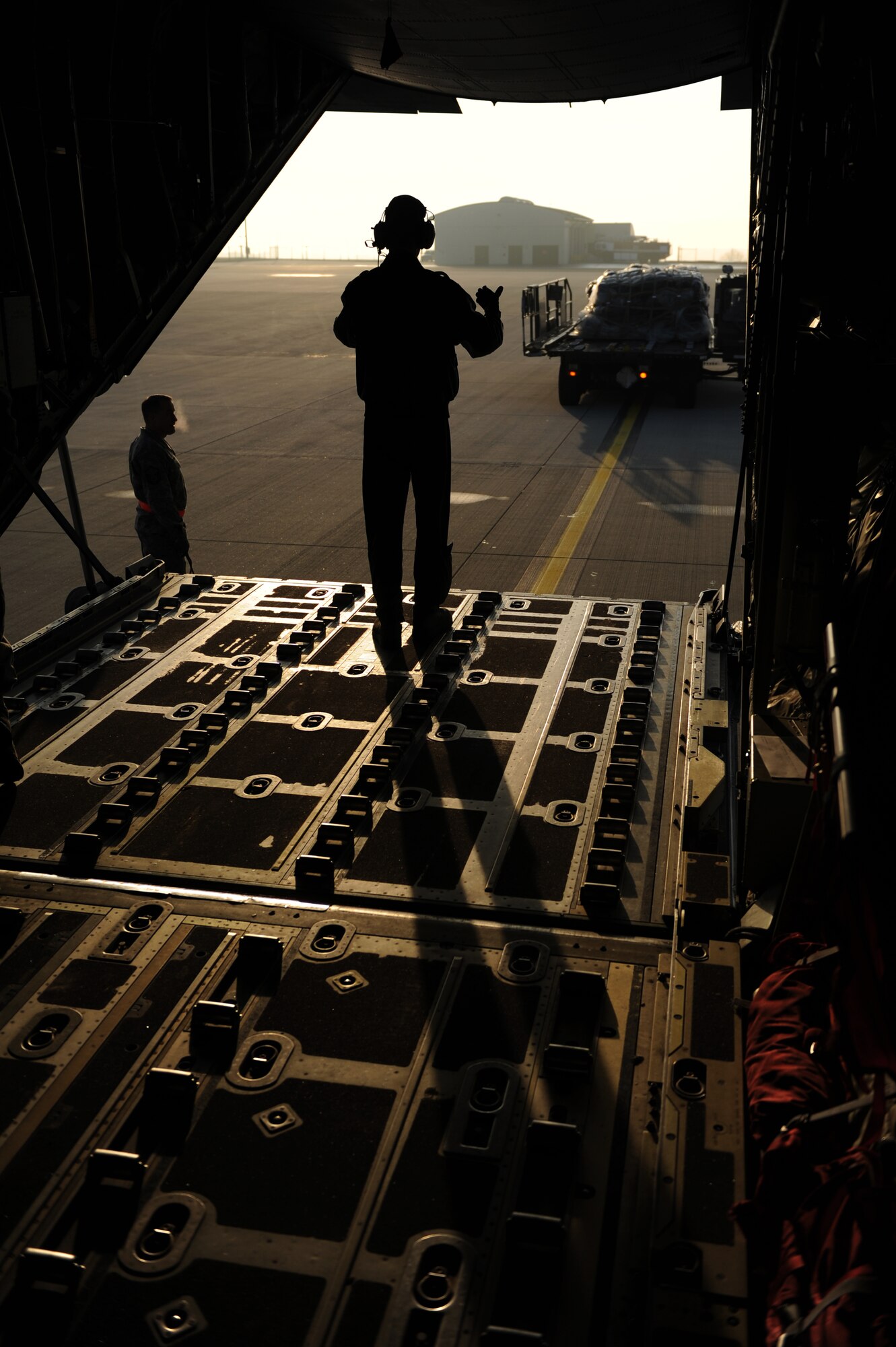 SPANGDAHLEM AIR BASE, Germany – An Airman guides a K-loader to the ramp of a C-130 Hercules here Feb. 27 to load cargo for a flight to Turkey in support of Anatolian Falcon 2012, a weapons training deployment that includes interdiction, attack, air superiority, defense suppression, airlift, air refueling and reconnaissance. More than 250 Airmen from the 52nd Fighter Wing will participate in the exercise hosted at Turkish air force’s Konya Air Base. The U.S. and Turkish air forces will work together and improve both nations’ combat readiness through tactical training during the exercise. (U.S. Air Force photo by Airman 1st Class Matthew B. Fredericks/Released)
