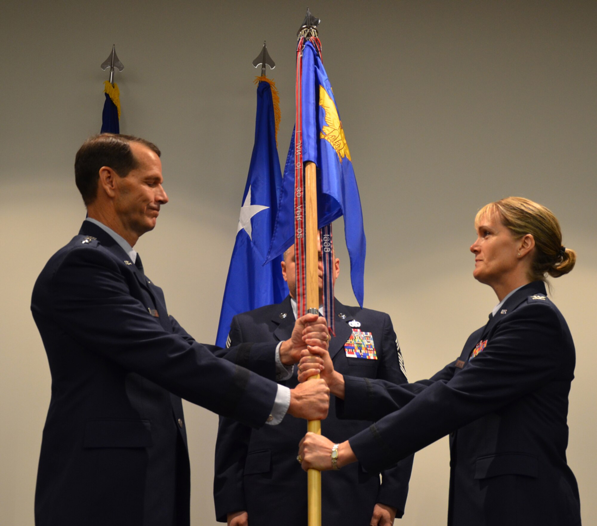 Col. Dawne Deskins receives the guidon from Lt. Gen. Stanley E. Clarke, Commander, CONR/1st Air Force (AFNORTH) during EADS change of command ceremony on Feb. 17. 