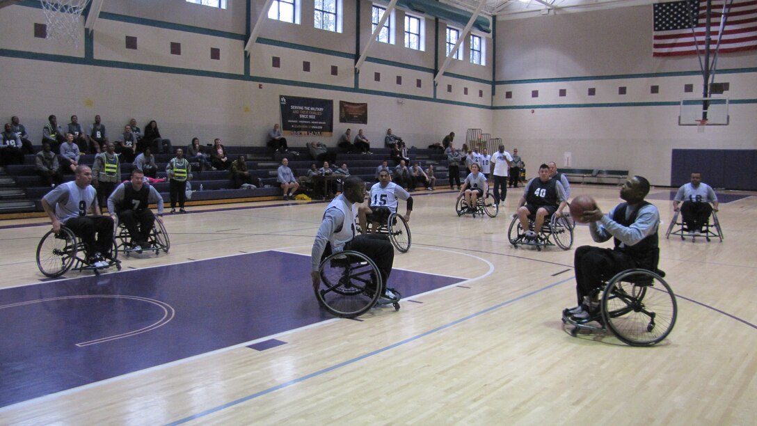 U.S. Sgt. Army Timothy Boyland of 1st Platoon pulls up a jumper from the outside during basketball action of the Warrior Transition Unit’s Adaptive Sports Day recently at the McClellan Fitness Center at Fort Eustis, Va. The Adaptive Sports Day attracted 34 participants and featured two competitive sports – sitting volleyball and wheelchair basketball.  (Photo by Marlon J. Martin/Released)