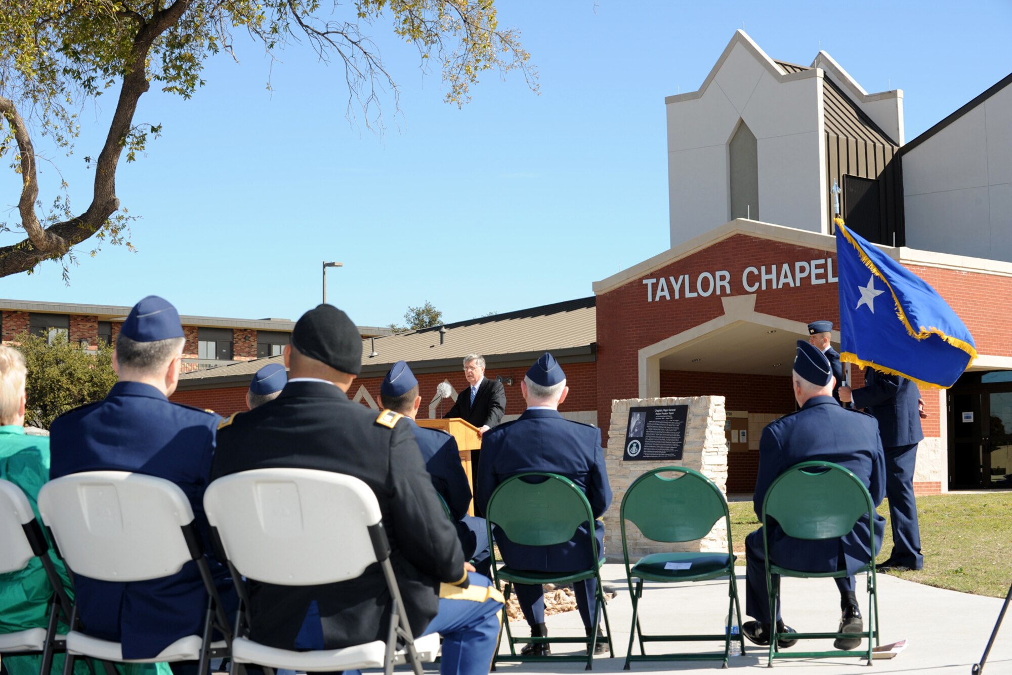 GOODFELLOW AIR FORCE BASE, Texas -- Robert Taylor, Jr., speaks during the dedication ceremony of the base chapel named in honor of his father Chaplain (Maj. Gen.) Robert Taylor Feb. 24. Chaplain Taylor entered military service in September 1940 and survived 42 months in Japanese prison camps, later going on to serve as a chaplain for an additional 20 years. (U.S. Air Force photo/Staff Sgt. Laura R. McFarlane)