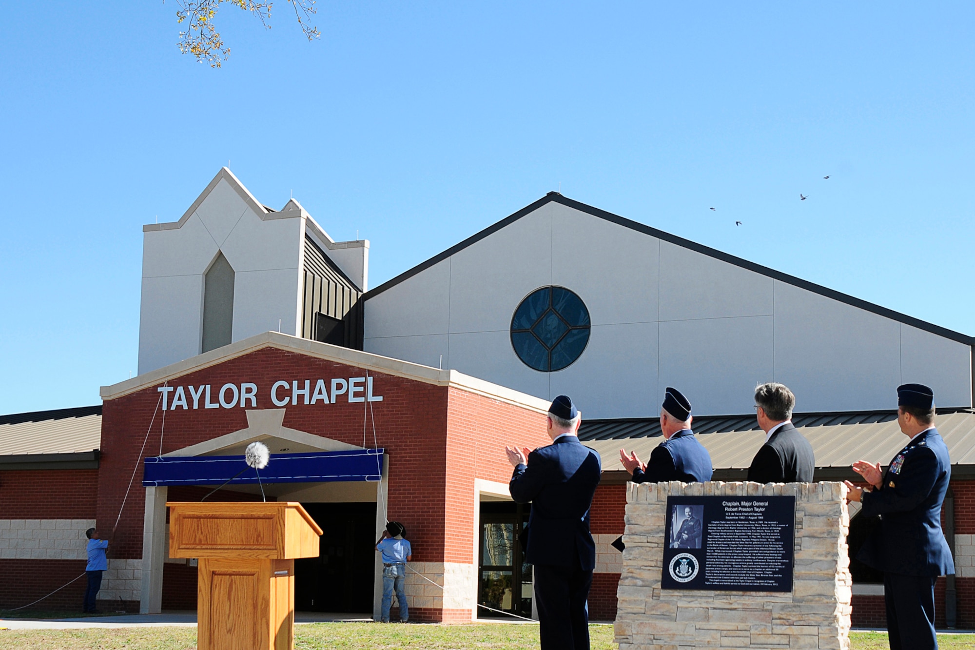 GOODFELLOW AIR FORCE BASE, Texas -- The name of the base chapel is unveiled during a dedication ceremony Feb. 24. The chapel was named in memory of Chaplain (Maj. Gen.) Robert Preston Taylor, who was the third U.S. Air Force Chief of Chaplains. (U.S. Air Force photo/Staff Sgt. Austin Knox)