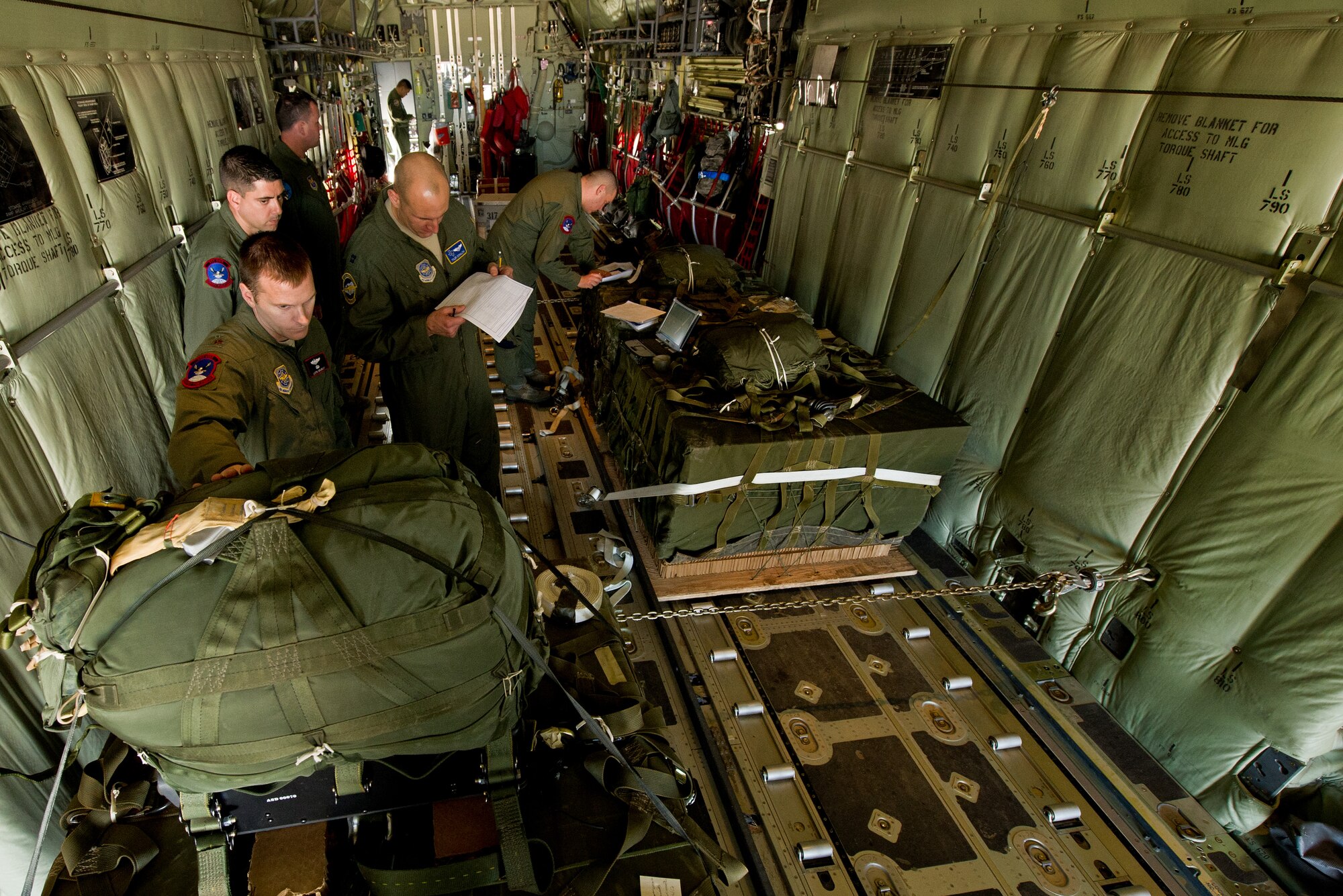 U.S. Air Force crew members, 40th Airlift Squadron, input global positioning system, (GPS) coordinates into the joint precision air drop system, (JPADS) on a C-130J Hercules Feb. 23, 2012 Dyess Air Force Base, Texas. JPADS uses GPS to guide the cargo accurately to the drop zone while the aircraft is safely out of reach from enemy fire. (U.S. Air Force photo by Staff Sgt. Jonathan Snyder/Released)
                           