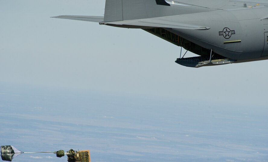 U.S. Air Force C-130J Hercules prepares to drop a joint precision air drop system, (JPADS) at almost 10,000 feet Feb. 22, 2012, at Fort Hood, Texas. JPADS uses global positioning system to guide the cargo accurately to the drop zone while the aircraft is safely out of reach from enemy fire. (U.S. Air Force photo by Staff Sgt. Jonathan Snyder/Released)