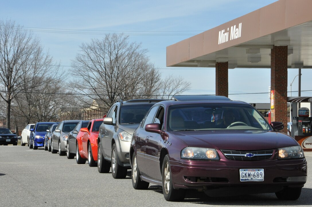 Junior enlisted Airman wait in line for a free tank of fuel at the gas station at Langley Air Force Base, Va., Feb. 27, 2012. The base’s First Sergeant’s Council pumped free fuel for junior enlisted personnel as part of their Random Acts of Kindness Program. (U.S. Air Force Photo by Tech. Sgt. Randy Redman/Released)