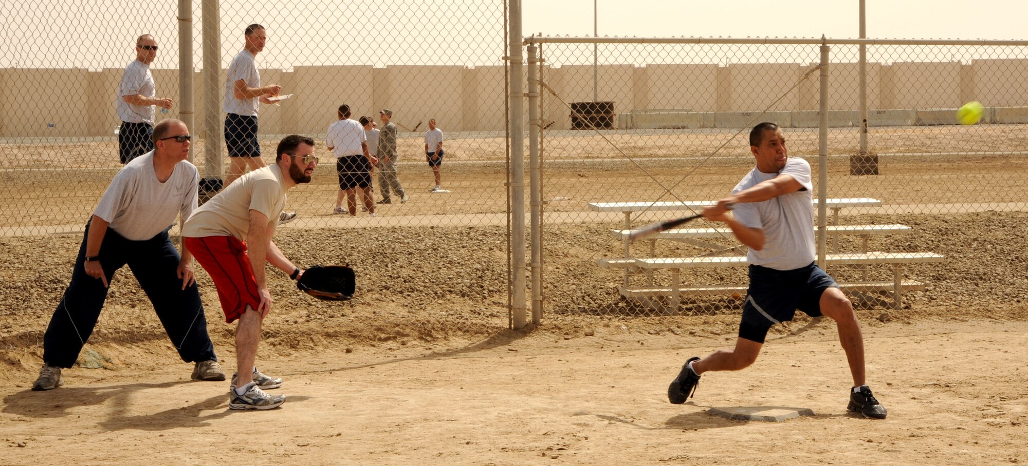 SOUTHWEST ASIA - Members of the 380th Air Expeditionary Wing participate in sports day Feb. 25, 2012. The Airmen and Soldiers played softball, volleyball, basketball, horseshoes and kickball. Hundreds gathered to enjoy the day with fun and food. (U.S. Air Force photo/Tech. Sgt. Arian Nead)  

