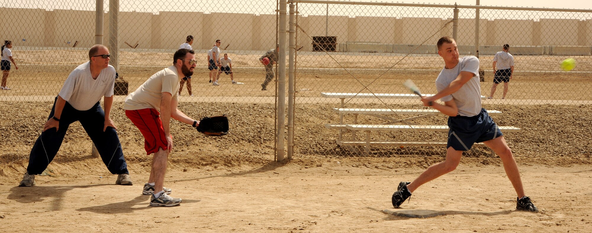 SOUTHWEST ASIA - Members of the 380th Air Expeditionary Wing participate in sports day Feb. 25, 2012. The Airmen and Soldiers played softball, volleyball, basketball, horseshoes and kickball. Hundreds gathered to enjoy the day with fun and food. (U.S. Air Force photo/Tech. Sgt. Arian Nead)  
