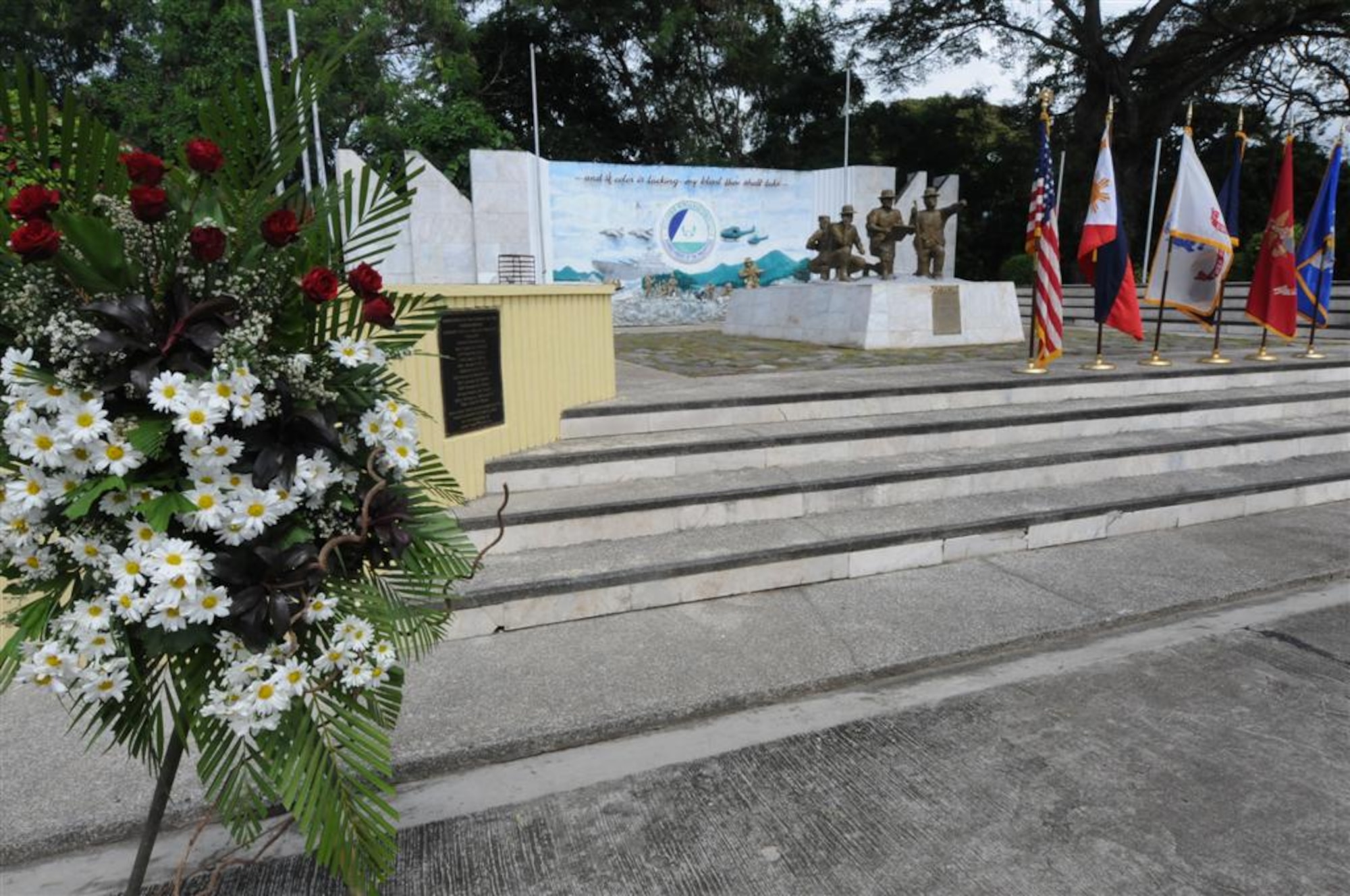 A wreath sits at the base of a memorial statue during a ceremony commemorating the crash of “Wild 42.”  Ten members of JSOTF-P died when their US MH-47E Chinook helicopter went down in the Bohol Sea while returning from a mission in Basilan in 2002. (U.S. Air Force photo by Major Darrick B. Lee/Released)