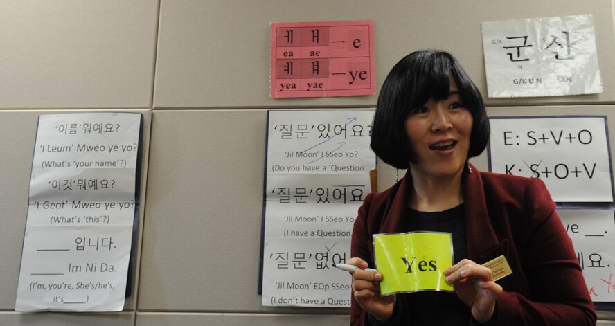 Kim Son-kyong, Airman and Family Readiness Center teacher, goes over the basics of Hangul with students at Kunsan Air Base, Republic of Korea, Feb. 14, 2012. Knowing basic phrases can make navigating and communicating here an easier process. (U.S. Air Force photo by Senior Airman Brigitte N. Brantley/Released)