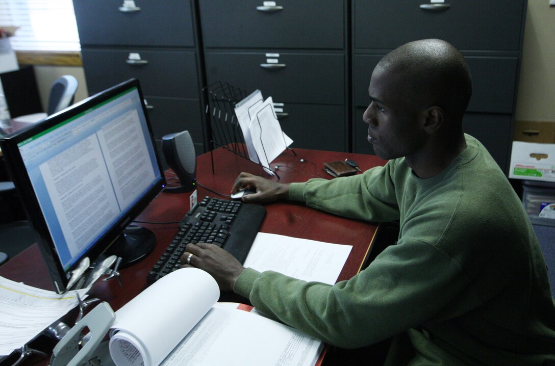 Lance Cpl. Kenny Jeanfelix, a legal service specialist with Combat Logistics Regiment 27, 2nd Marine Logistics Group, finishes work before physical training aboard Camp Lejeune, N.C., Feb. 27, 2012. The Brooklyn, N.Y., native was nominated for a meritorious promotion after being chosen by Staff Sgt. Tony Holmes, the military justice staff noncommissioned officer in charge, for his leadership, abilities and traits. (U.S. Marine Corps photo by Pfc. Franklin E. Mercado)