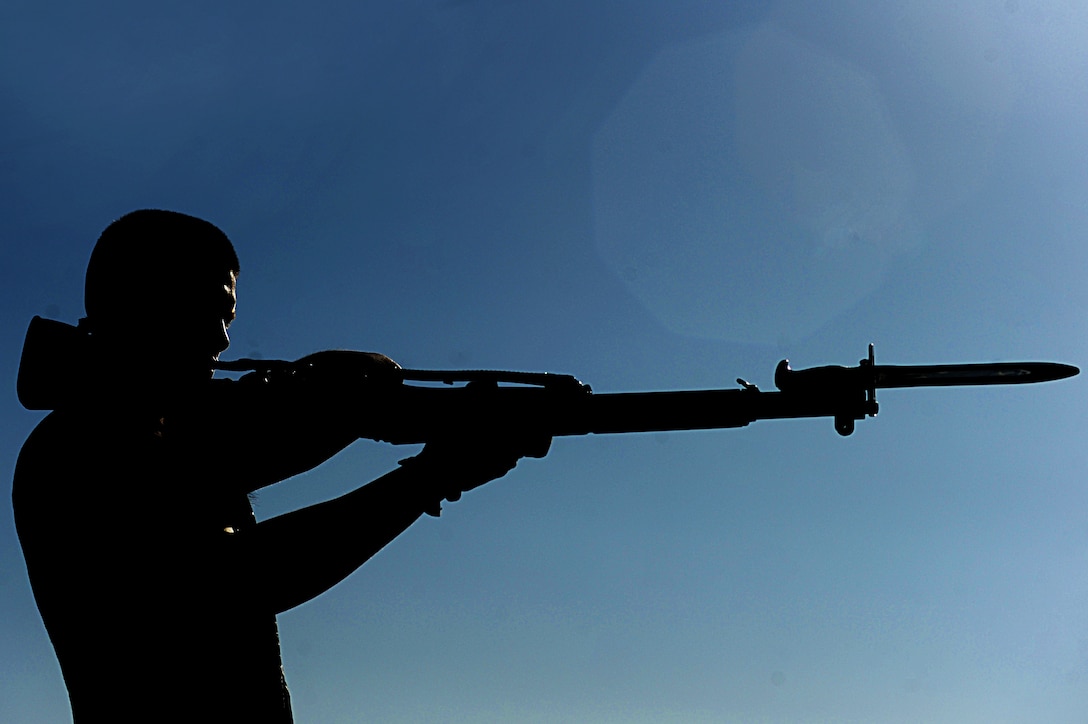 Lance Cpl. Angel Cruz, a Marine Silent Drill Platoon member and native of La Puente, Calif., performs a rifle spin during practice in preparation for the Battle Color Detachment’s upcoming performances in the local area at Marine Corps Air Station Yuma, Ariz., Feb. 28, 2012.  SDP, the U.S. Marine Drum & Bugle Corps and U.S. Marine Corps Color Guard, compose the BCD and all are Marine Barracks Washington-based. The BCD is scheduled to commence its National Installation Tour at the beginning of March.