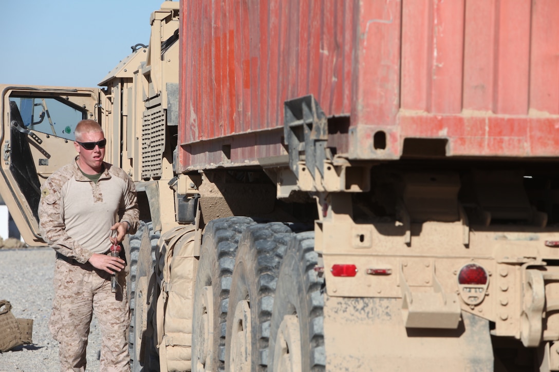 Lance Cpl. Tristan McBlane, a motor transport operator with Motor Transport Company, Combat Logistics Battalion 1, 1st Marine Logistics Group (Forward), prepares to unload a truck full of mail at Patrol Base Dehli, Afghanistan, Feb. 29. CLB-1 Marines also delivered food and 27,000 gallons of water in support of service members with 3rd Battalion, 3rd Marine Regiment, Regimental Combat Team 5.