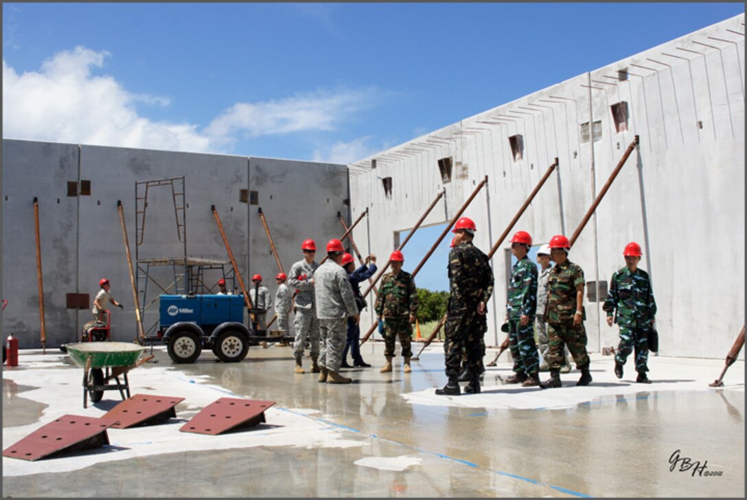 Airmen from the 36th Civil Engineer Squadron discuss structural procedures and tactics with delegates from the Philippine Air Force, Royal Cambodian Air Force, Royal Lao Air Force, Royal Thai Air Force, Mongolian Air Force and Vietnam People’s Air Force . As part of U.S. Pacific Command’s Theater Security Cooperation Program, a multilateral subject-matter expert exchange co-hosted by senior civil engineer and security forces personnel from Headquarters 13th Air Force concluded here Feb. 23. (U.S. Air Force photo/ Capt. Grant Harwell)
